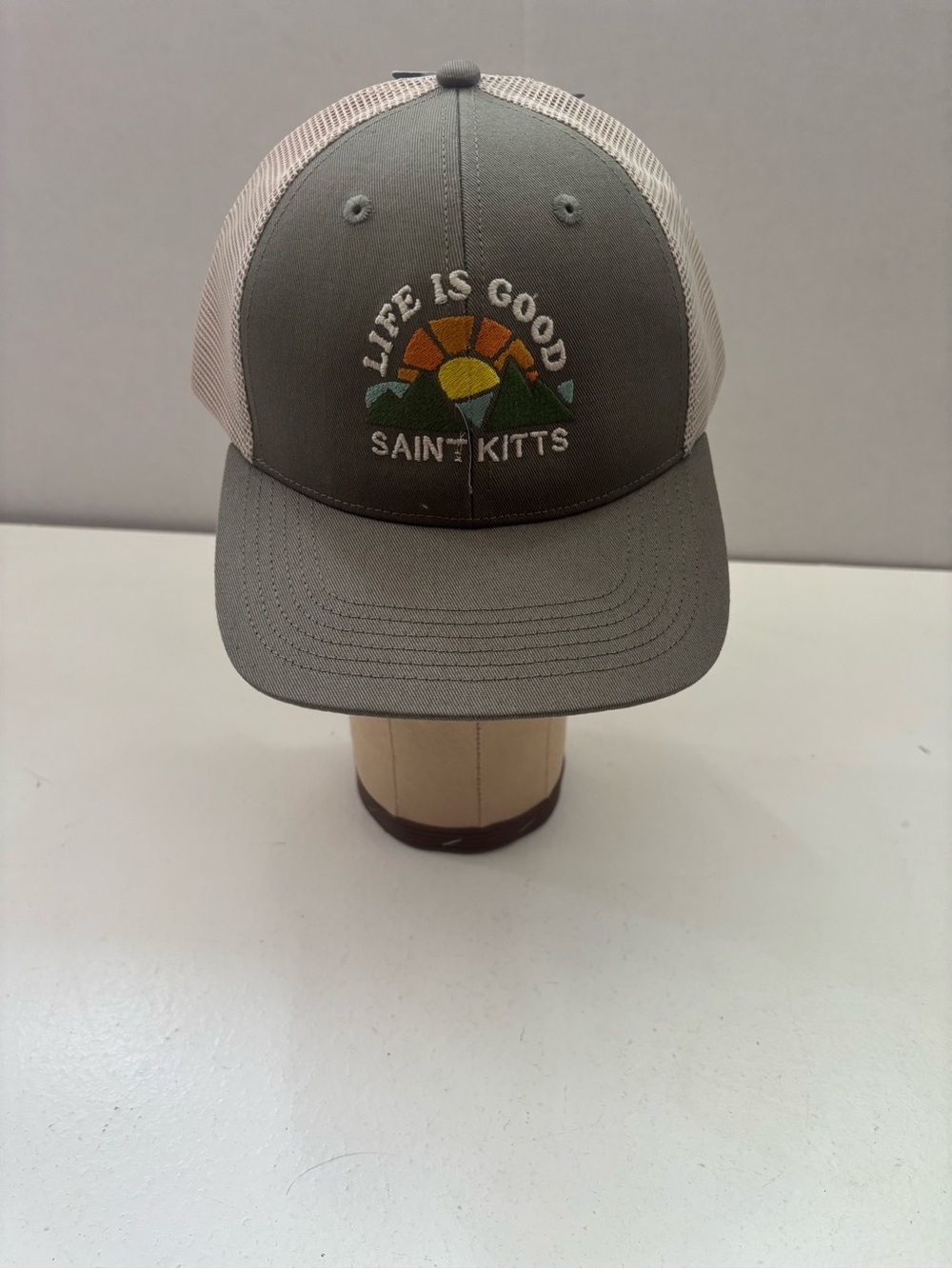 Life is Good Trucker hat mountain sunset patch that says Saint Kitts.